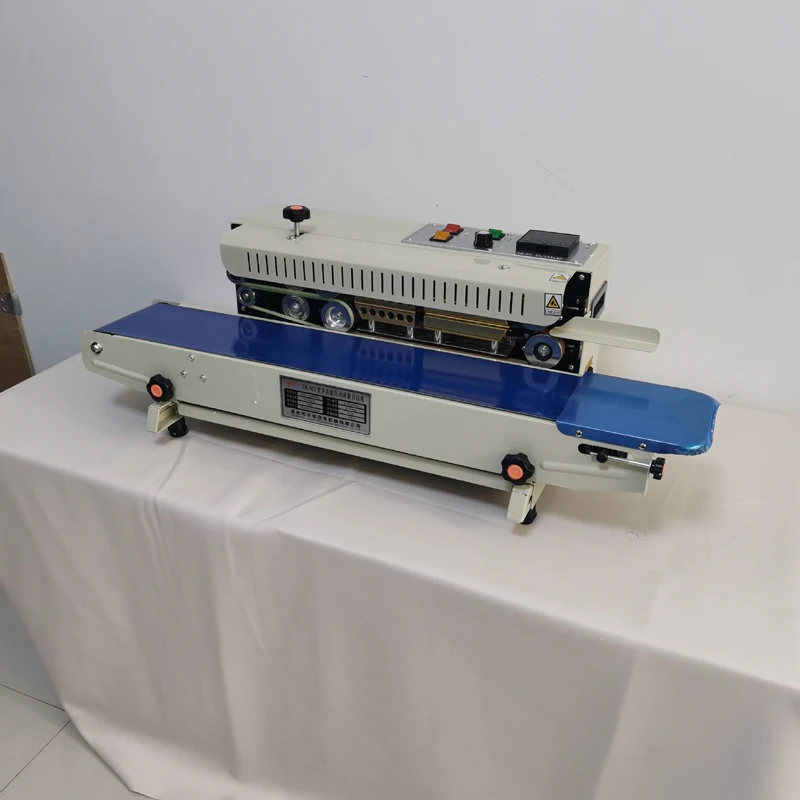 Машина за запечатване на хоризонтални фолио, опаковъчна машина за пластмасови торбички, машина за постоянно запечатване на лентата с контрол на температурата Изображение 1